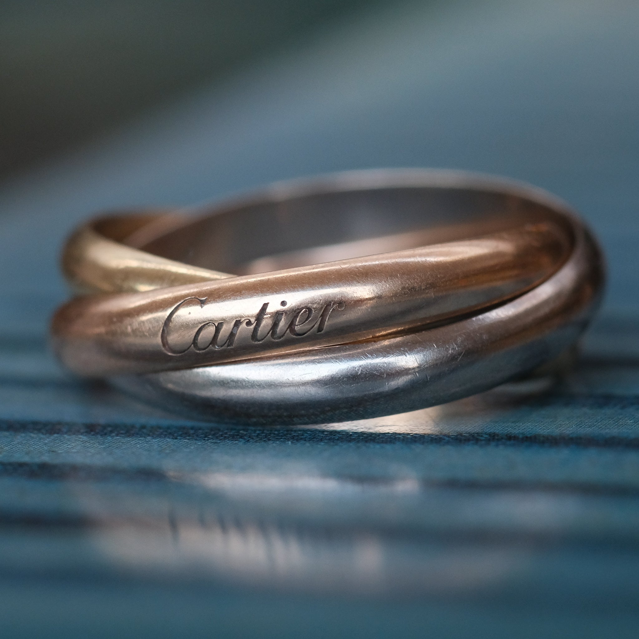 https://lostowl.com/cdn/shop/products/cartier-trinity-ring-366791.jpg?v=1701515967&utm_source=chatgpt.com